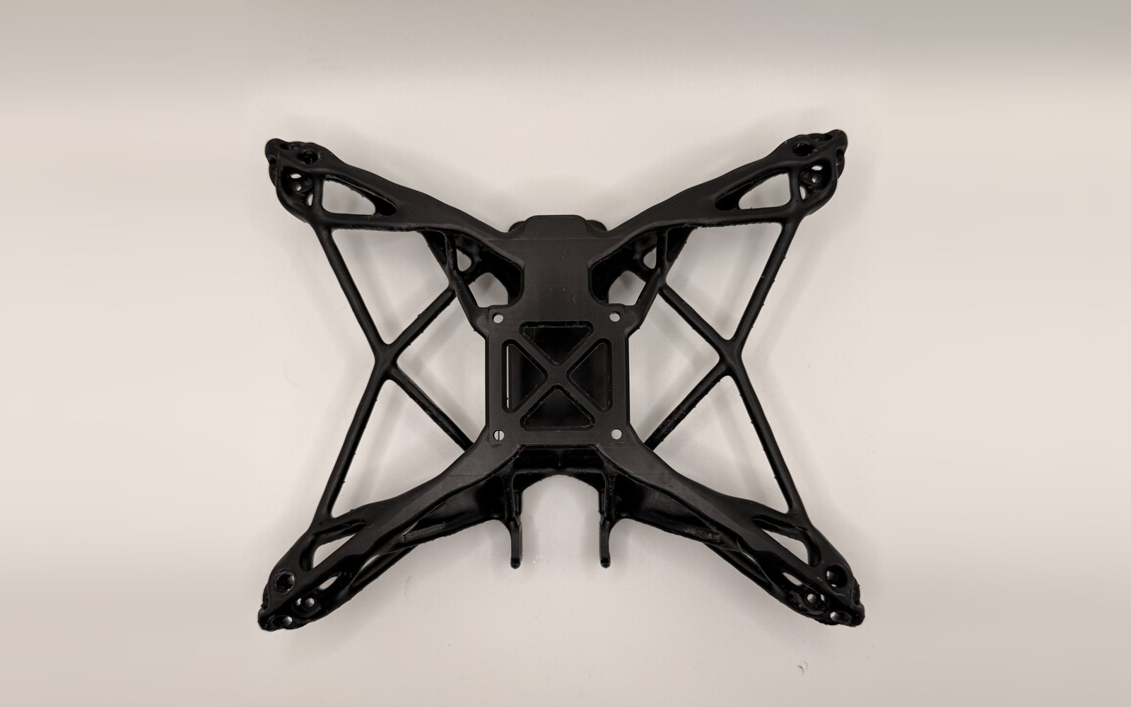Topology-optimised SLA drone frame