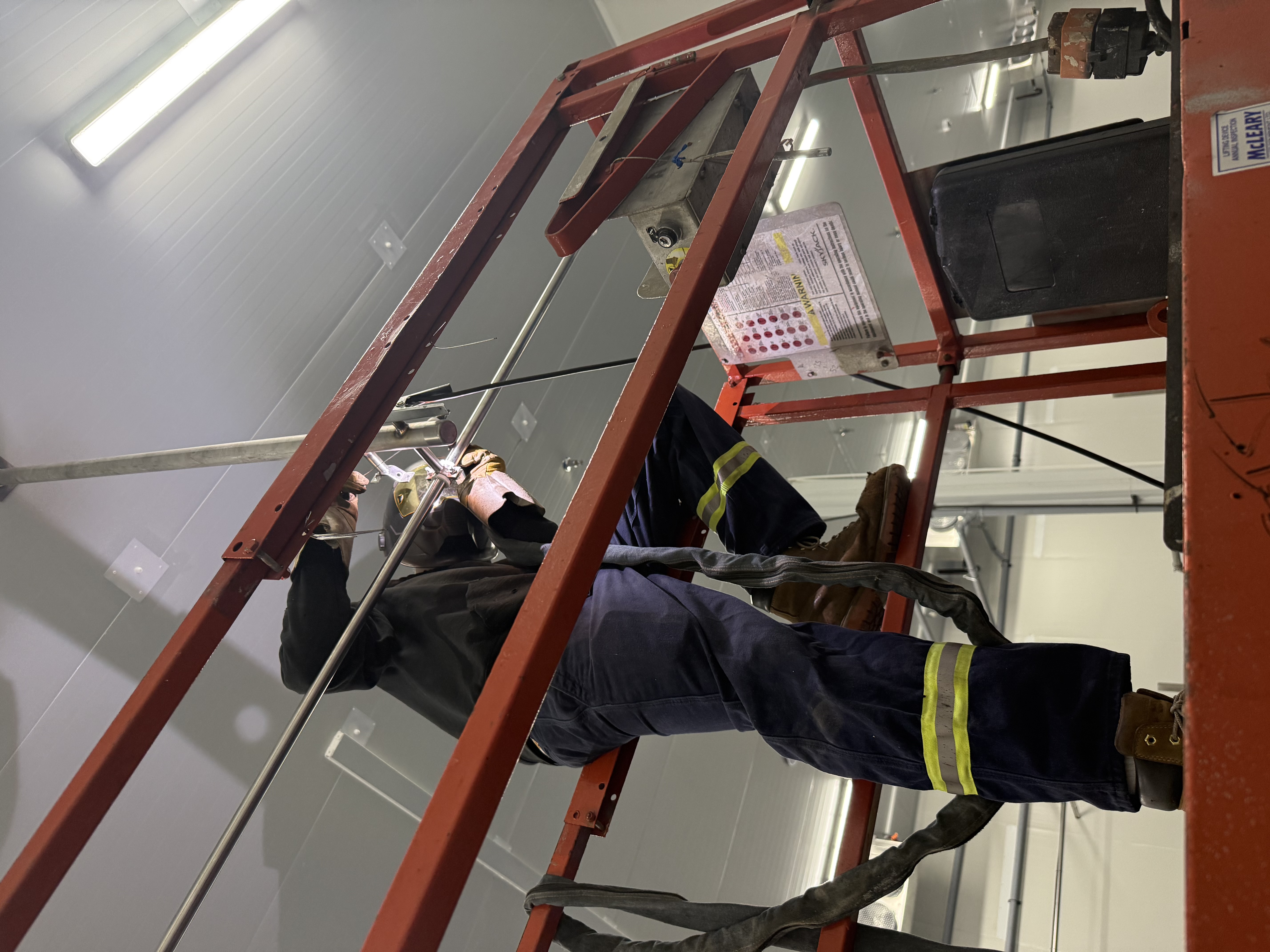 Ethan welding on-site at height